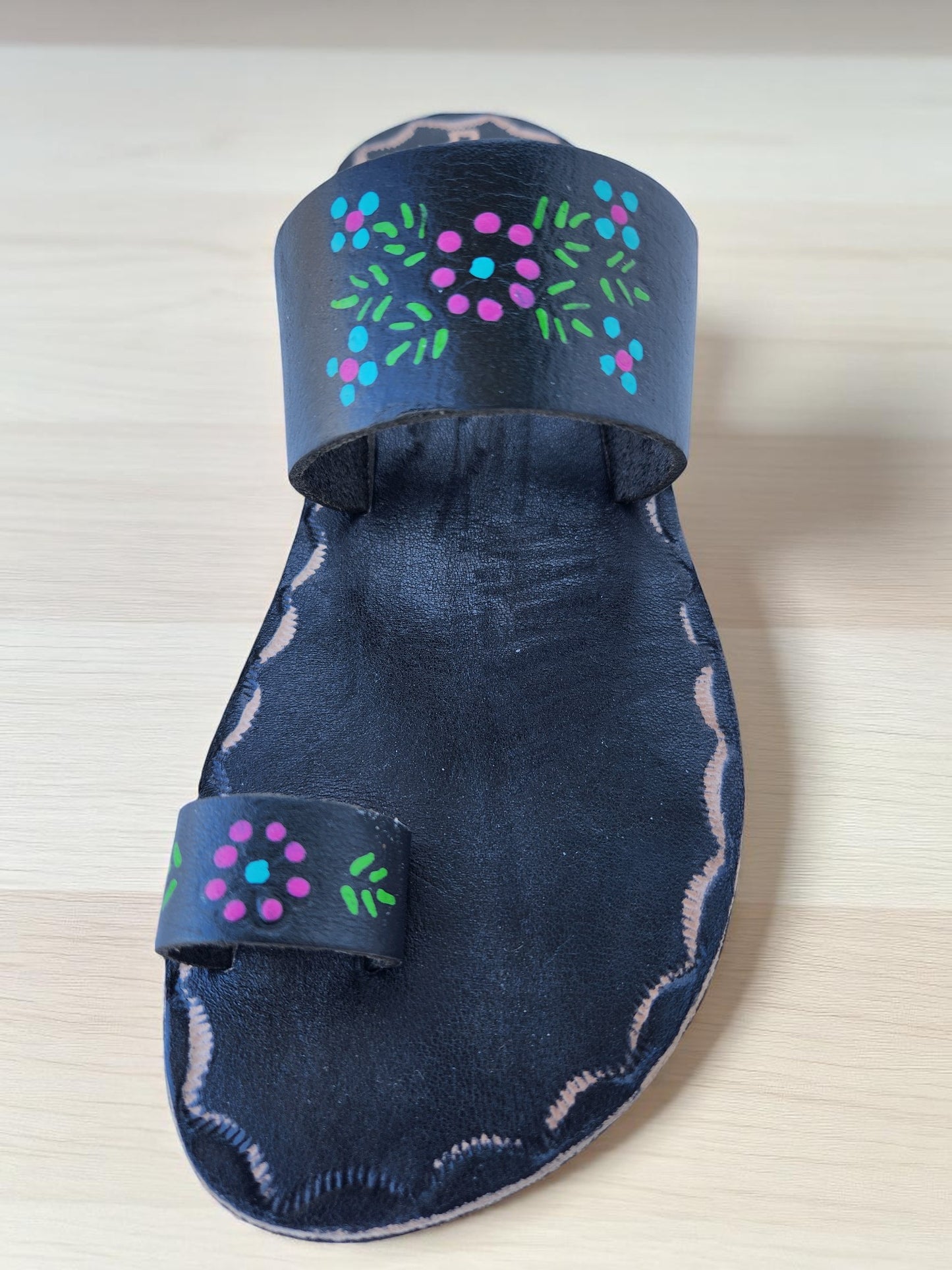 BLack soft leather handmade toe-ring sandals with durable lightweight outsoles and hand-painted floral pattern