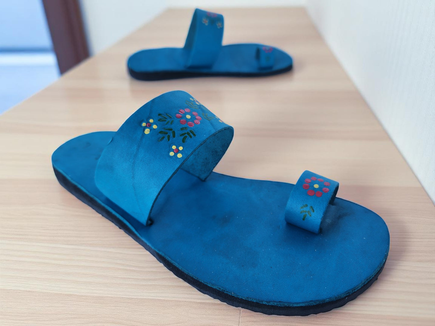Teal turquoise color soft leather handmade toe-ring sandals with durable lightweight outsoles and hand-painted floral pattern (