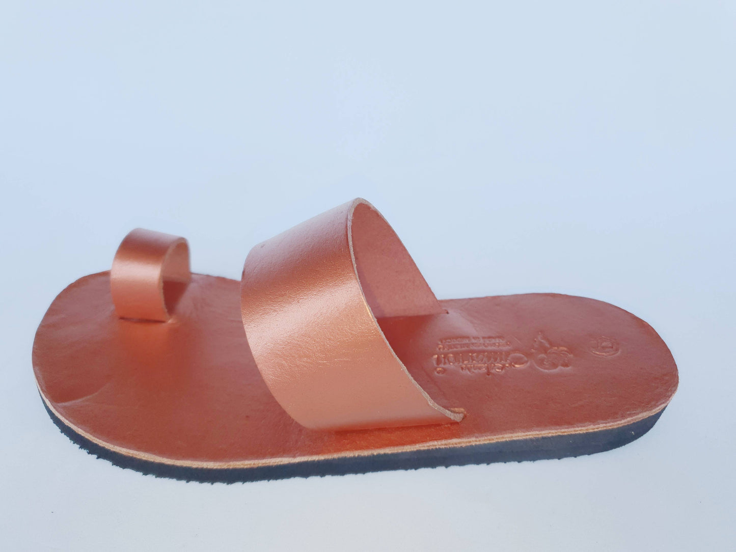 Copper color soft leather handmade toe-ring sandals with durable lightweight outsoles and hand-painted floral pattern