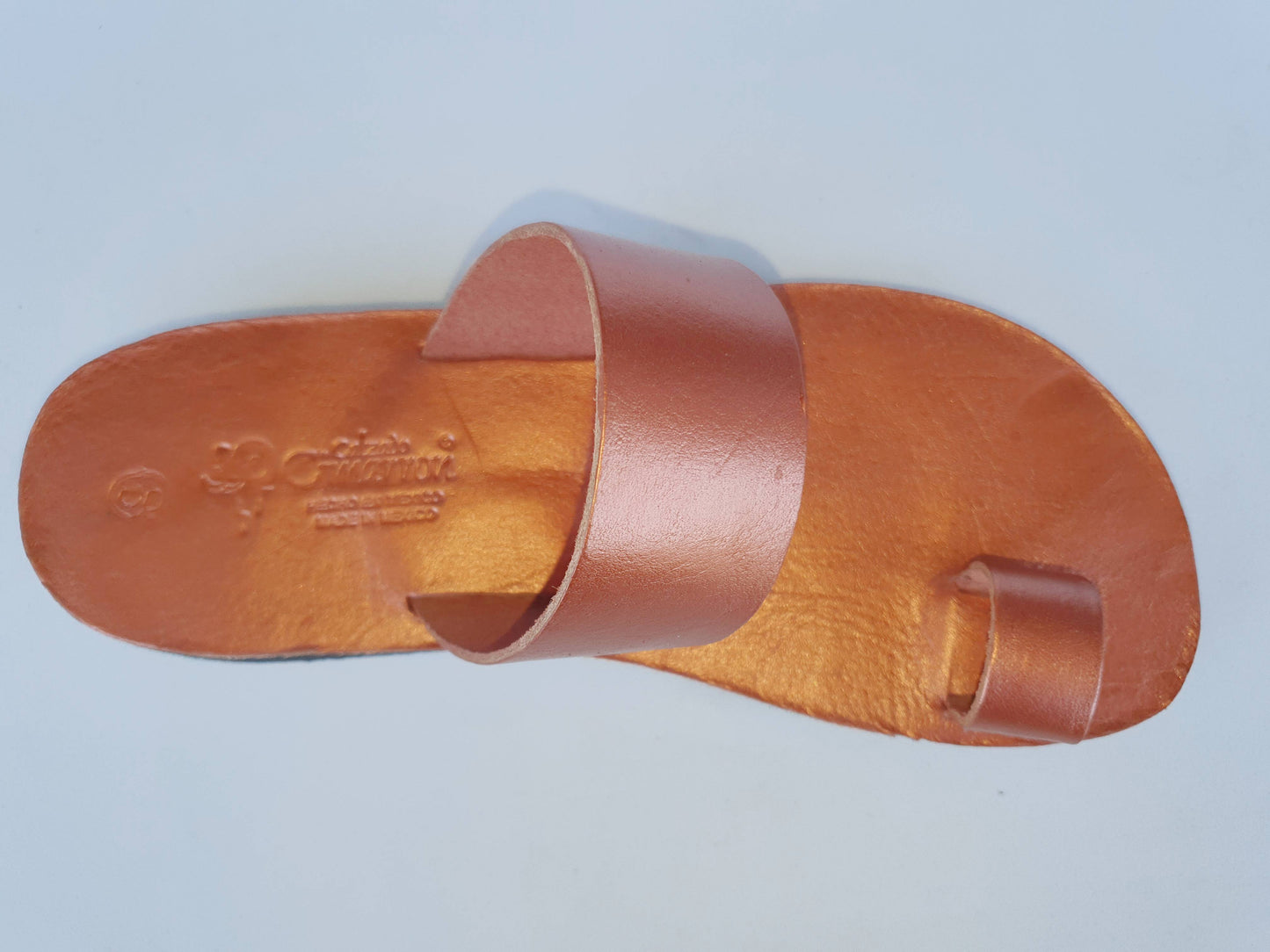 Copper color soft leather handmade toe-ring sandals with durable lightweight outsoles and hand-painted floral pattern