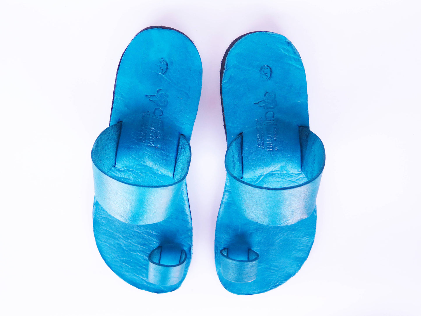Teal turquoise color soft leather handmade toe-ring sandals with durable lightweight outsoles and hand-painted floral pattern