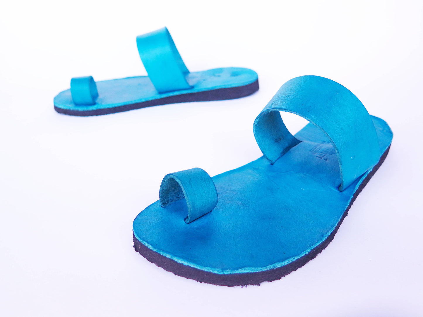 Teal turquoise color soft leather handmade toe-ring sandals with durable lightweight outsoles and hand-painted floral pattern