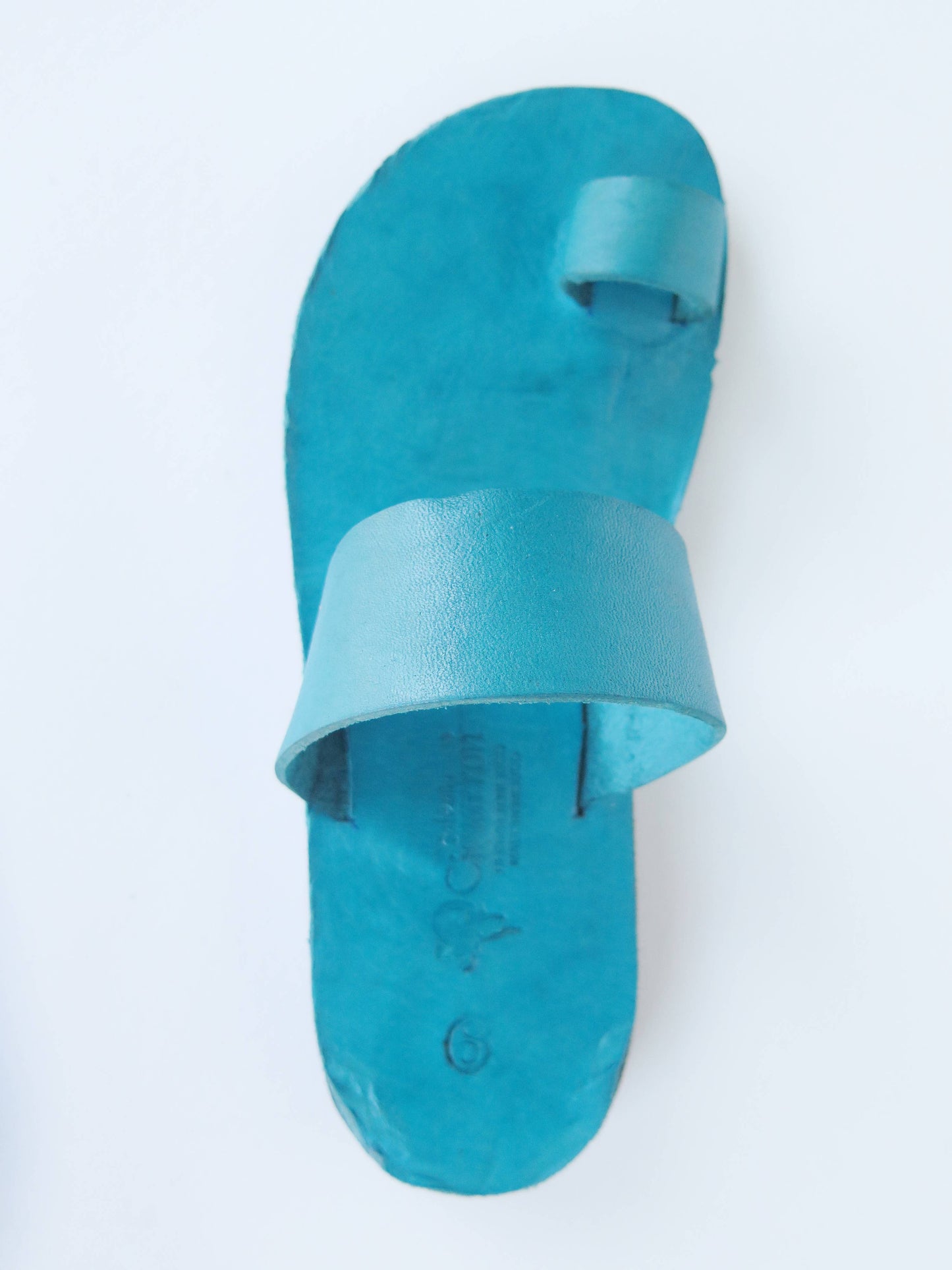 Teal turquoise color soft leather handmade toe-ring sandals with durable lightweight outsoles and hand-painted floral pattern