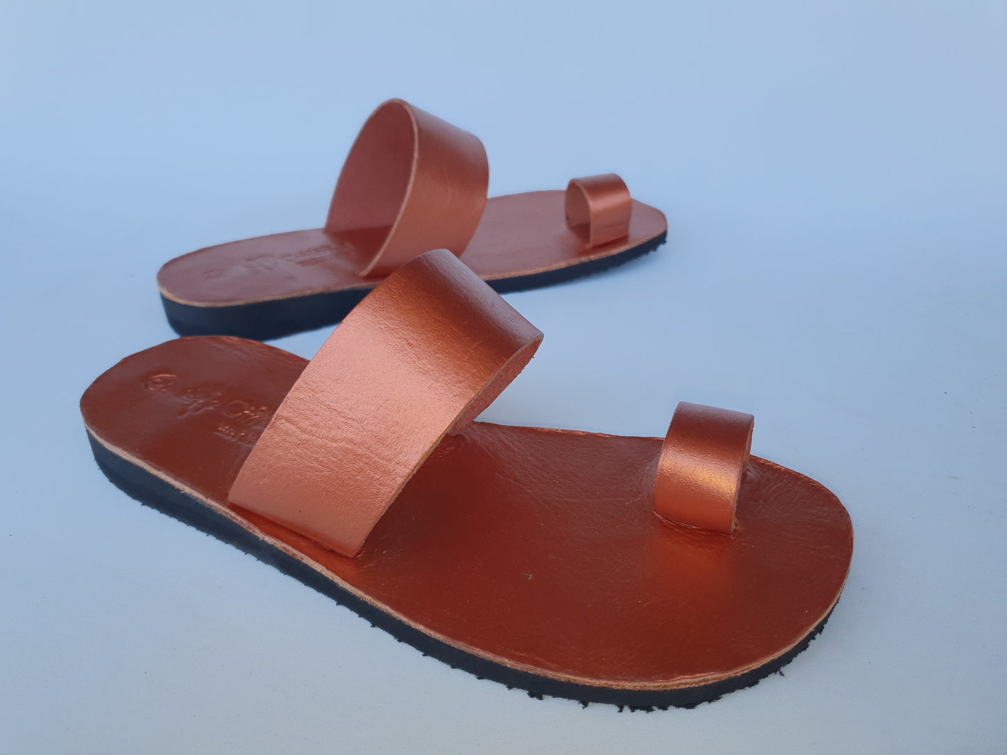 Copper color soft leather handmade toe-ring sandals with durable lightweight outsoles and hand-painted floral pattern