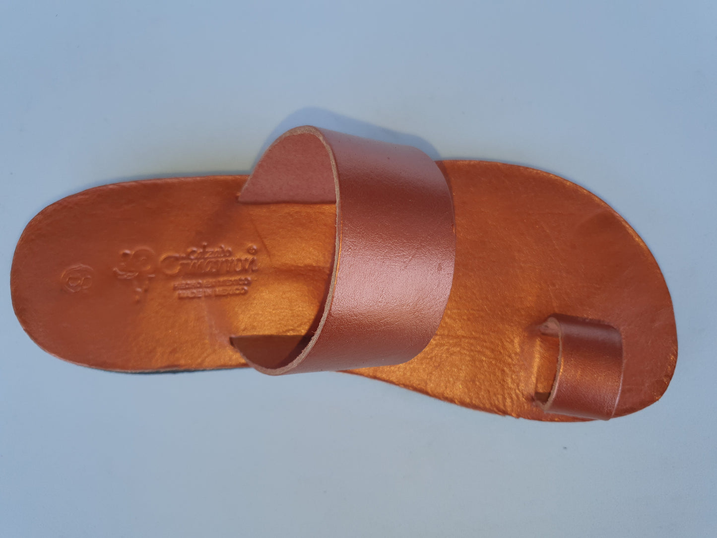 Copper color soft leather handmade toe-ring sandals with durable lightweight outsoles and hand-painted floral pattern