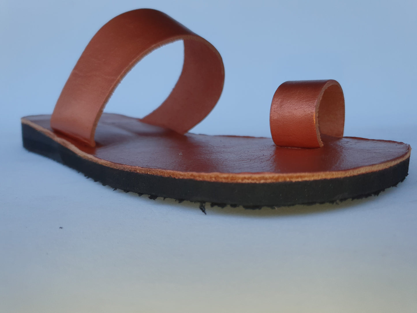 Copper color soft leather handmade toe-ring sandals with durable lightweight outsoles and hand-painted floral pattern