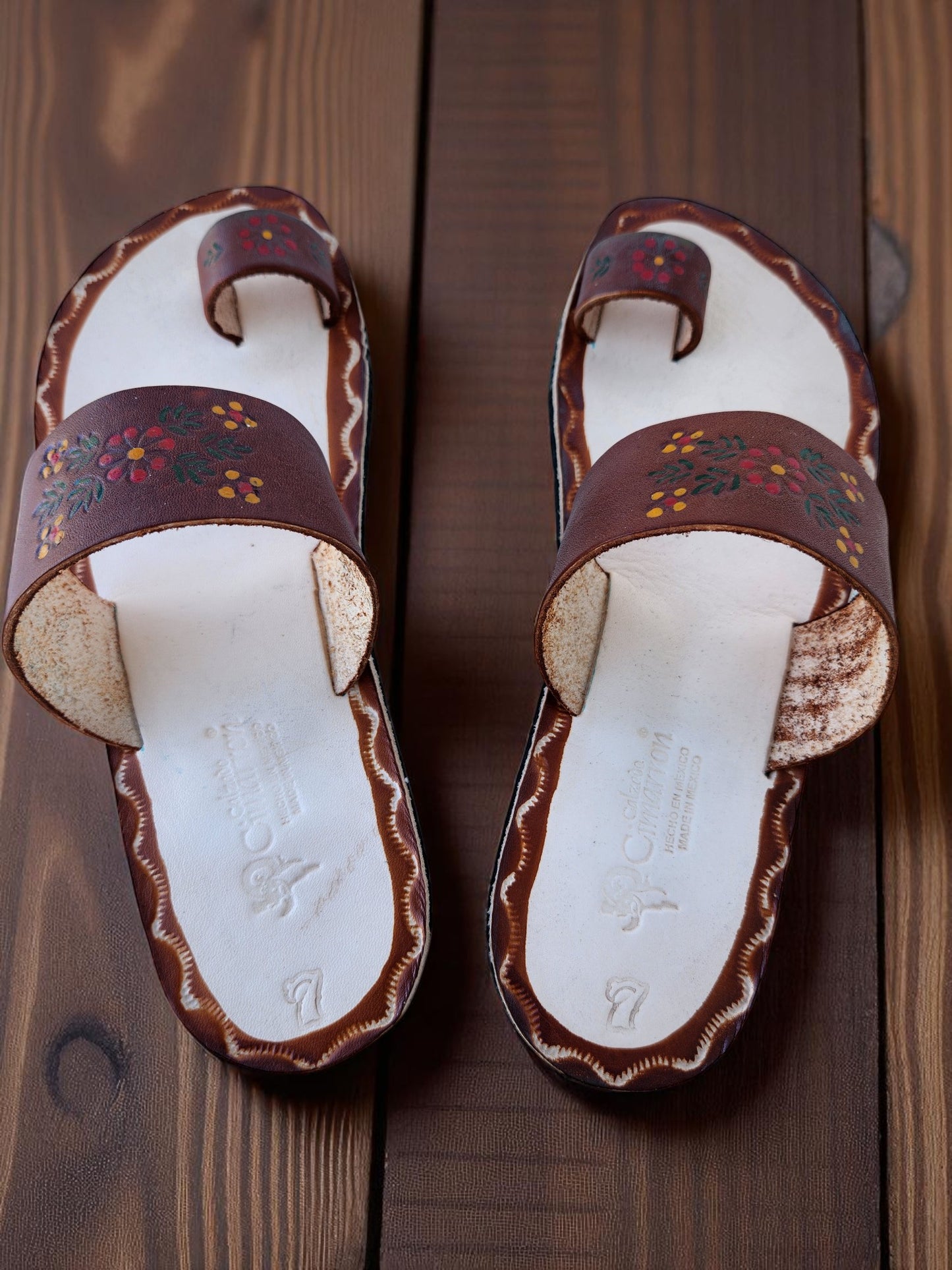 Brown and beige soft leather handmade toe-ring sandals with  durable lightweight outsoles and hand-painted floral pattern