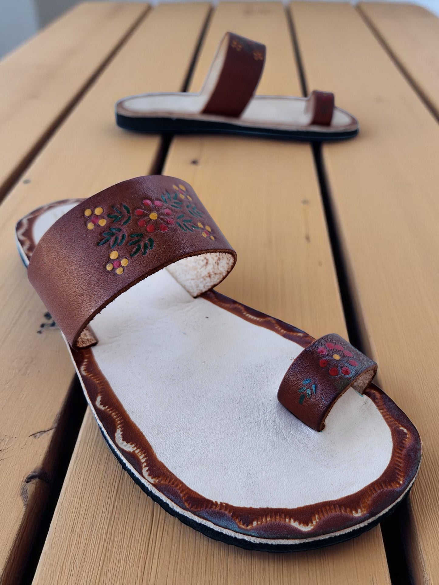 Brown and beige soft leather handmade toe-ring sandals with  durable lightweight outsoles and hand-painted floral pattern