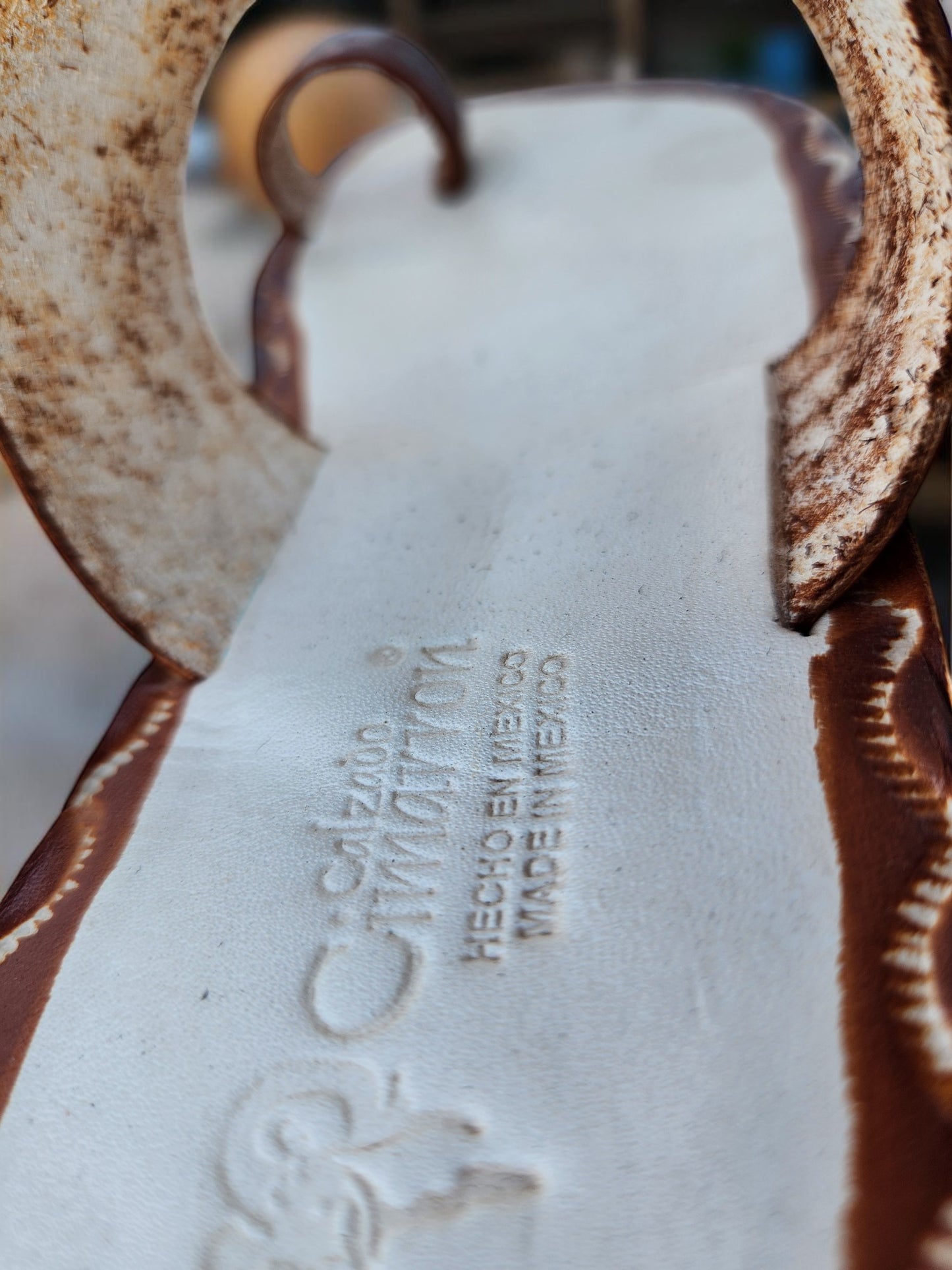 Brown and beige soft leather handmade toe-ring sandals with  durable lightweight outsoles and hand-painted floral pattern