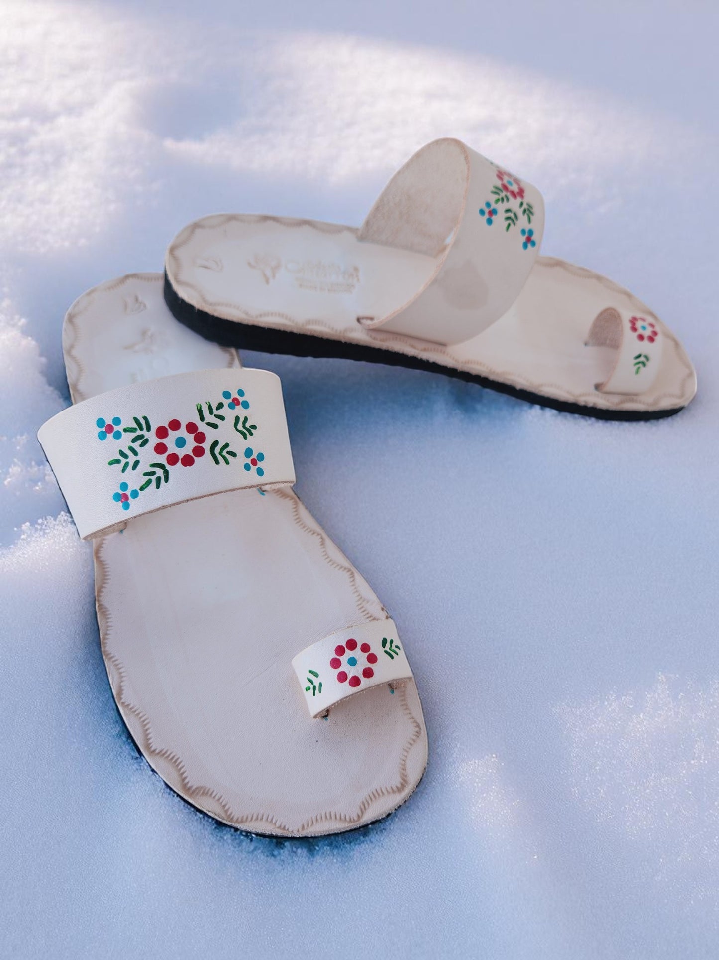 Beige soft leather handmade toe-ring sandals with  durable lightweight outsoles and hand-painted floral pattern.