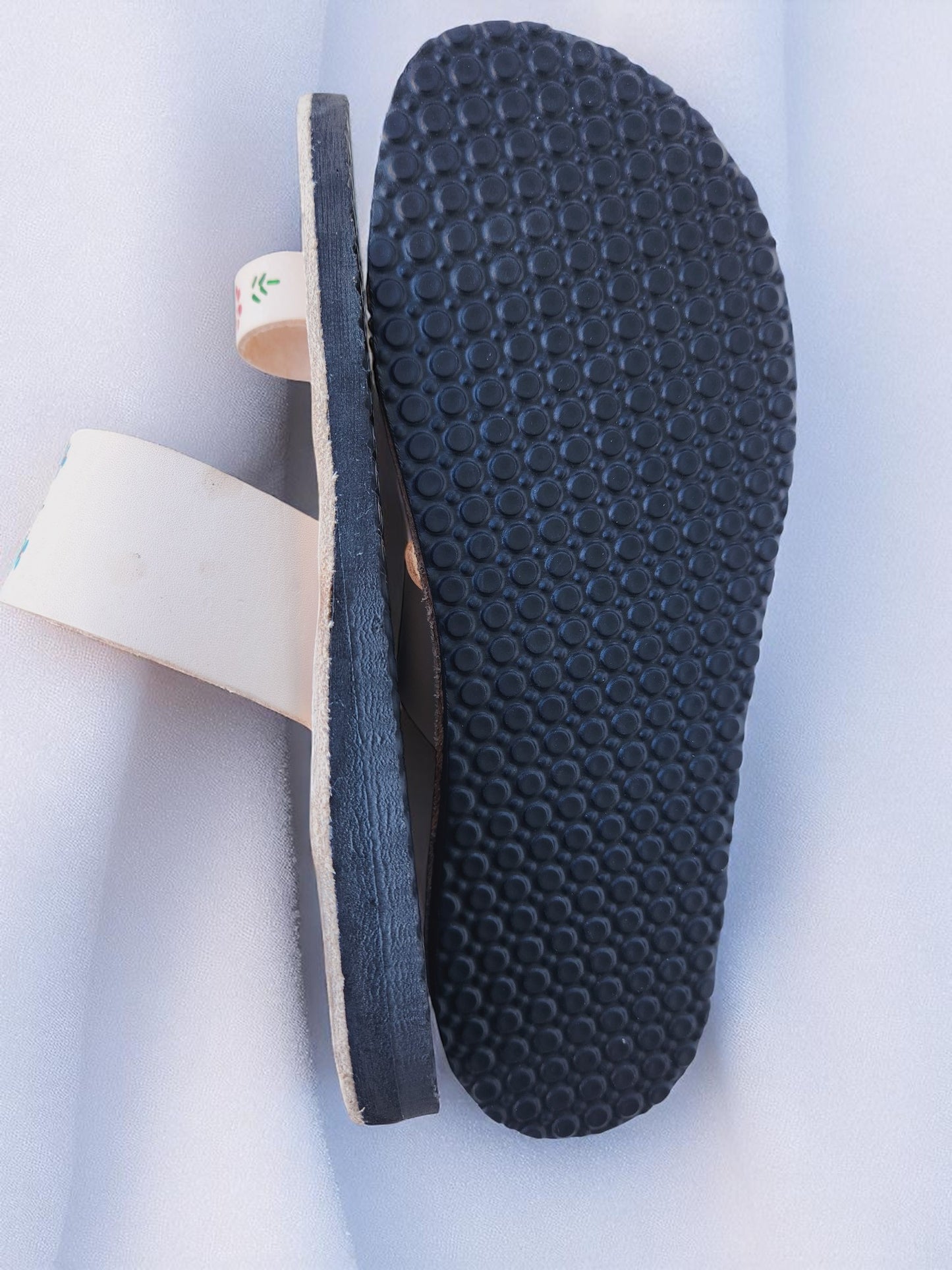 Beige soft leather handmade toe-ring sandals with  durable lightweight outsoles and hand-painted floral pattern.