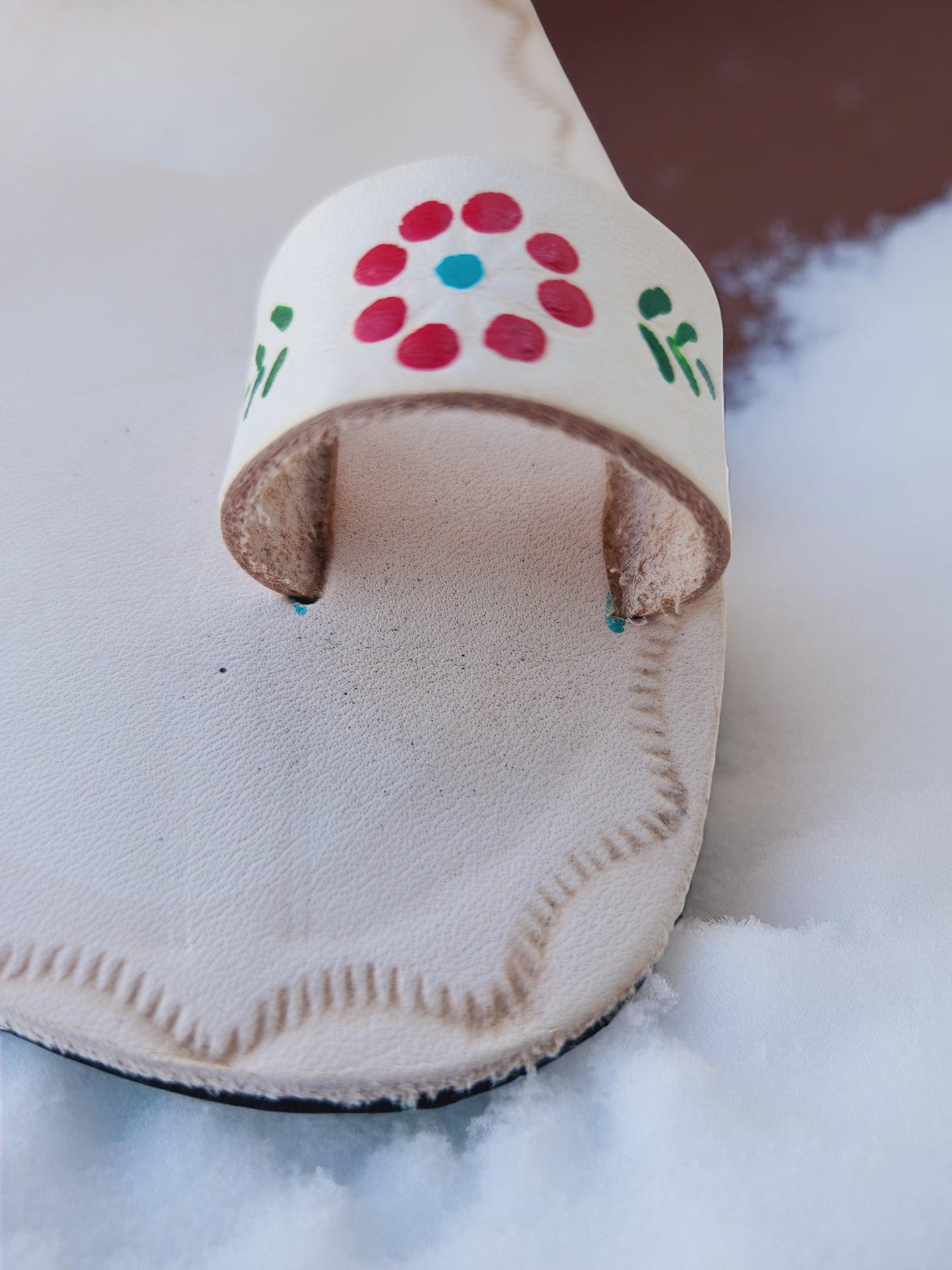 Beige soft leather handmade toe-ring sandals with  durable lightweight outsoles and hand-painted floral pattern.