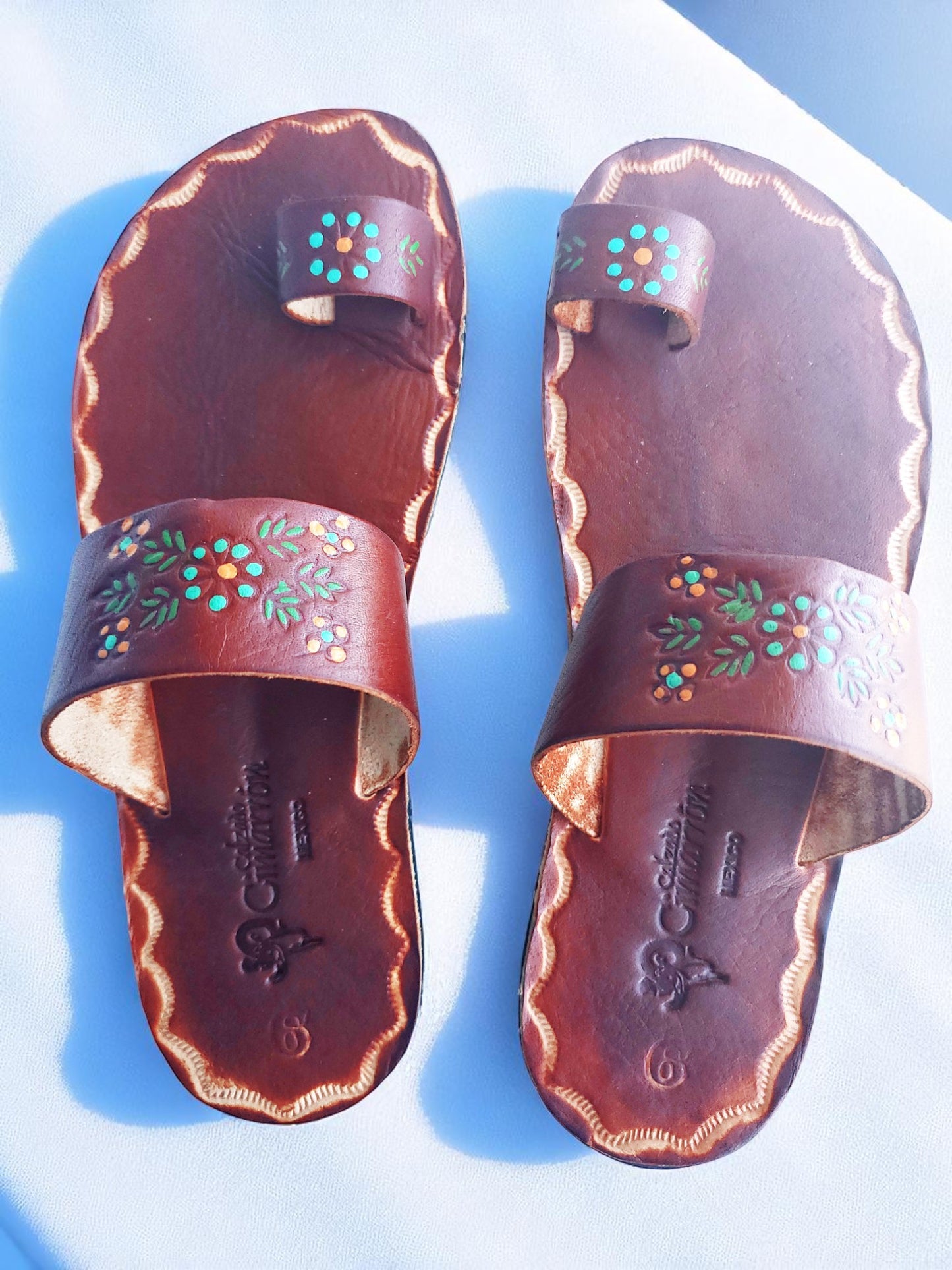 Brown soft leather handmade toe-ring sandals with  durable lightweight outsoles and hand-painted floral pattern