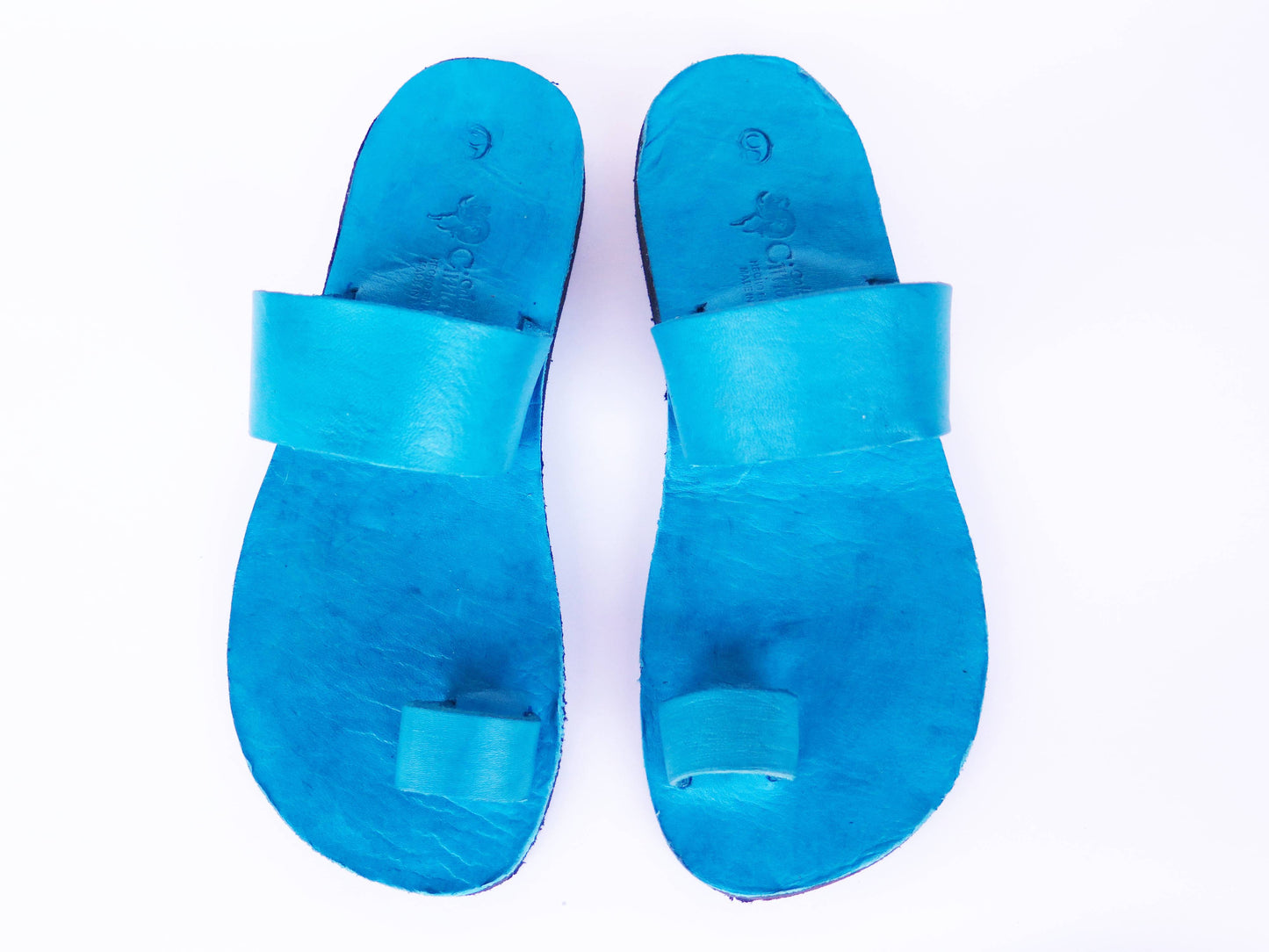 Teal turquoise color soft leather handmade toe-ring sandals with  durable lightweight outsoles and hand-painted floral pattern