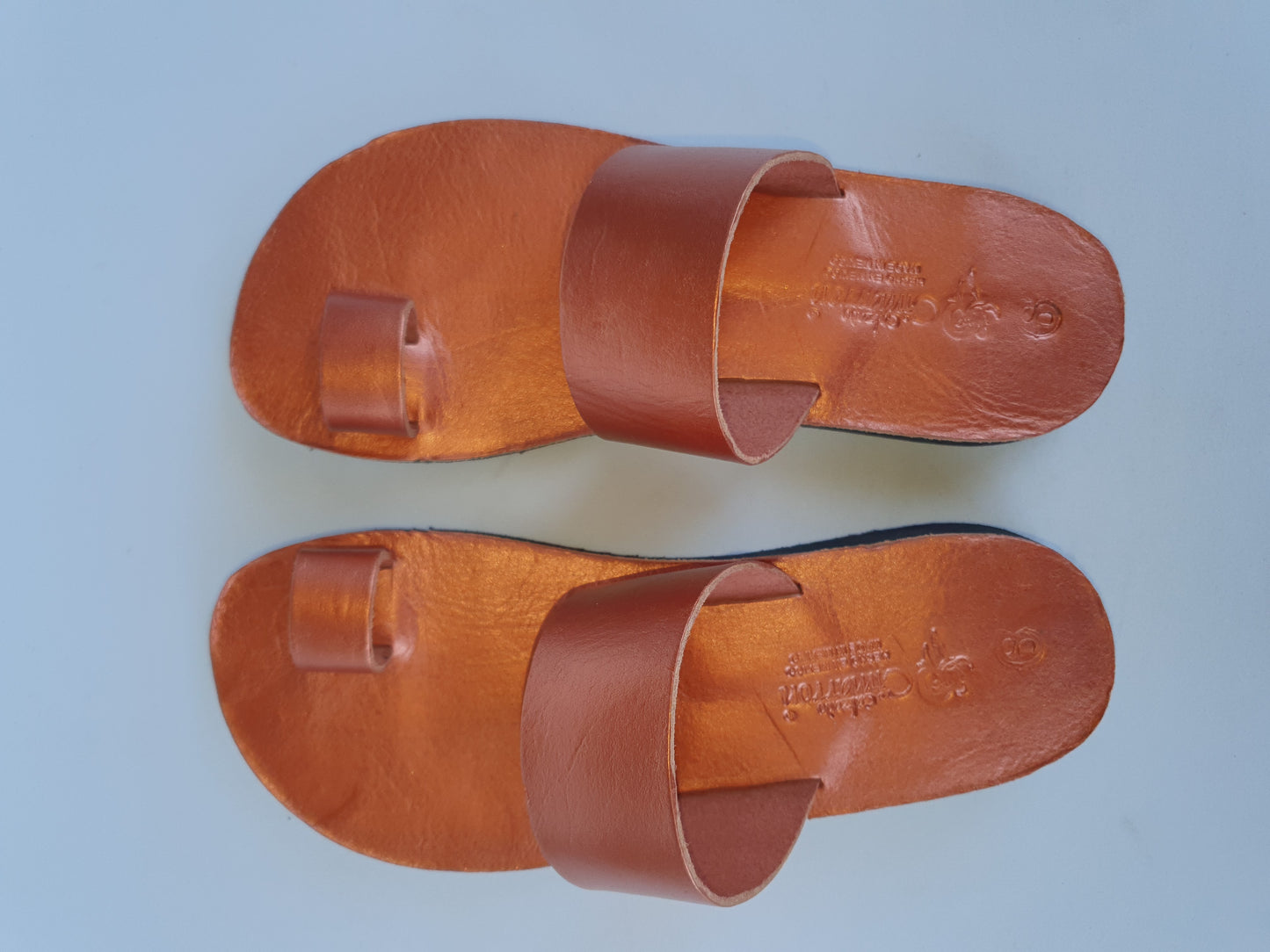 Copper color soft leather handmade toe-ring sandals with  durable lightweight outsoles and hand-painted floral pattern