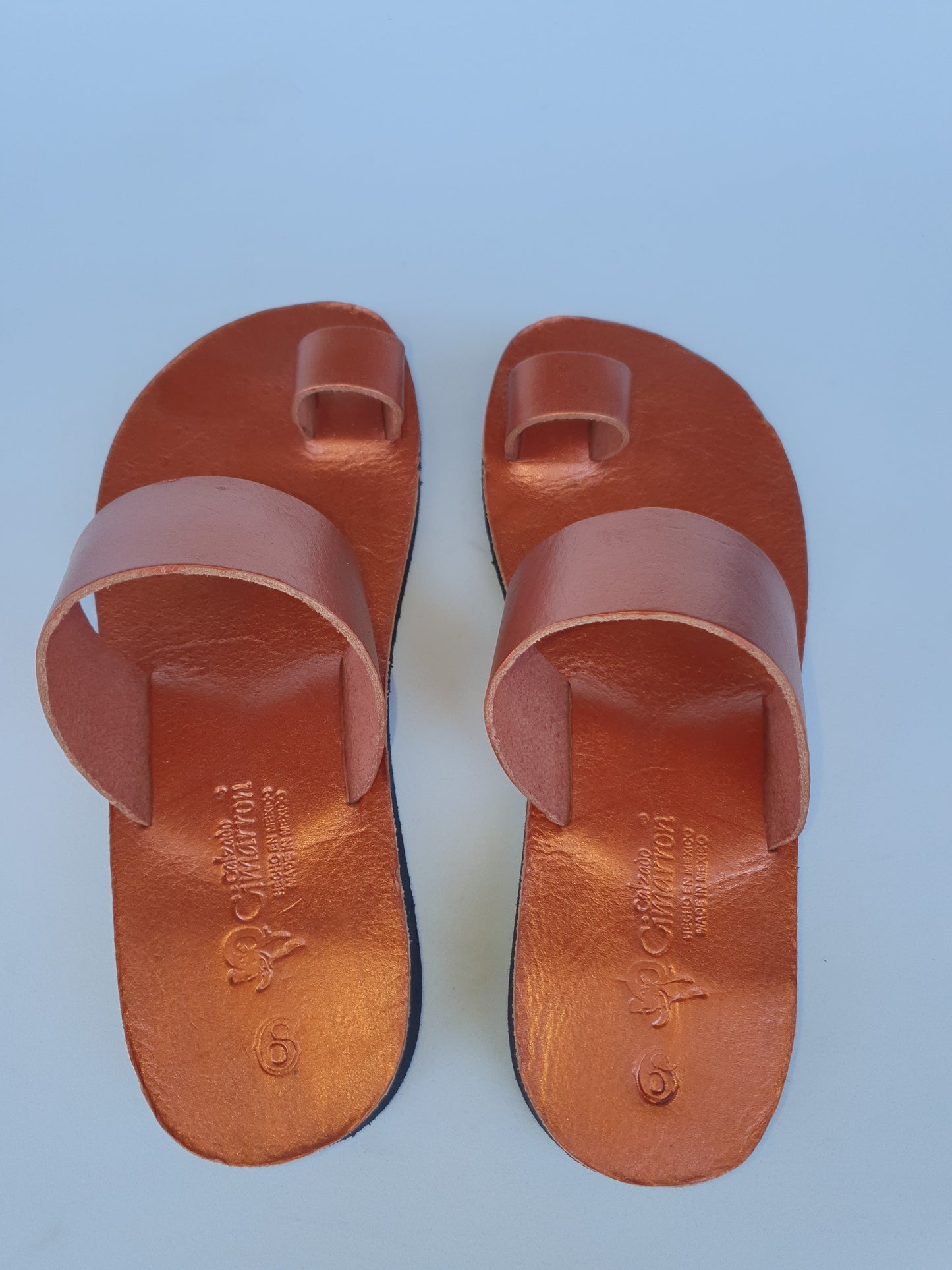 Copper color soft leather handmade toe-ring sandals with  durable lightweight outsoles and hand-painted floral pattern
