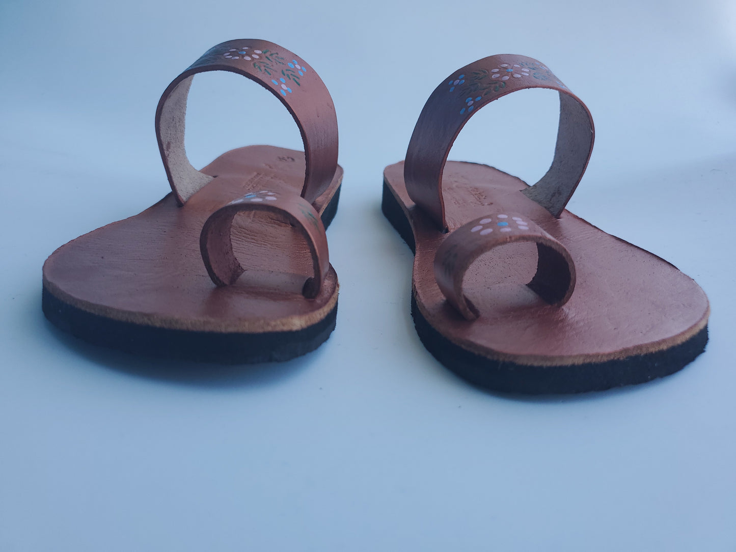Copper color soft leather handmade toe-ring sandals with  durable lightweight outsoles and hand-painted floral pattern