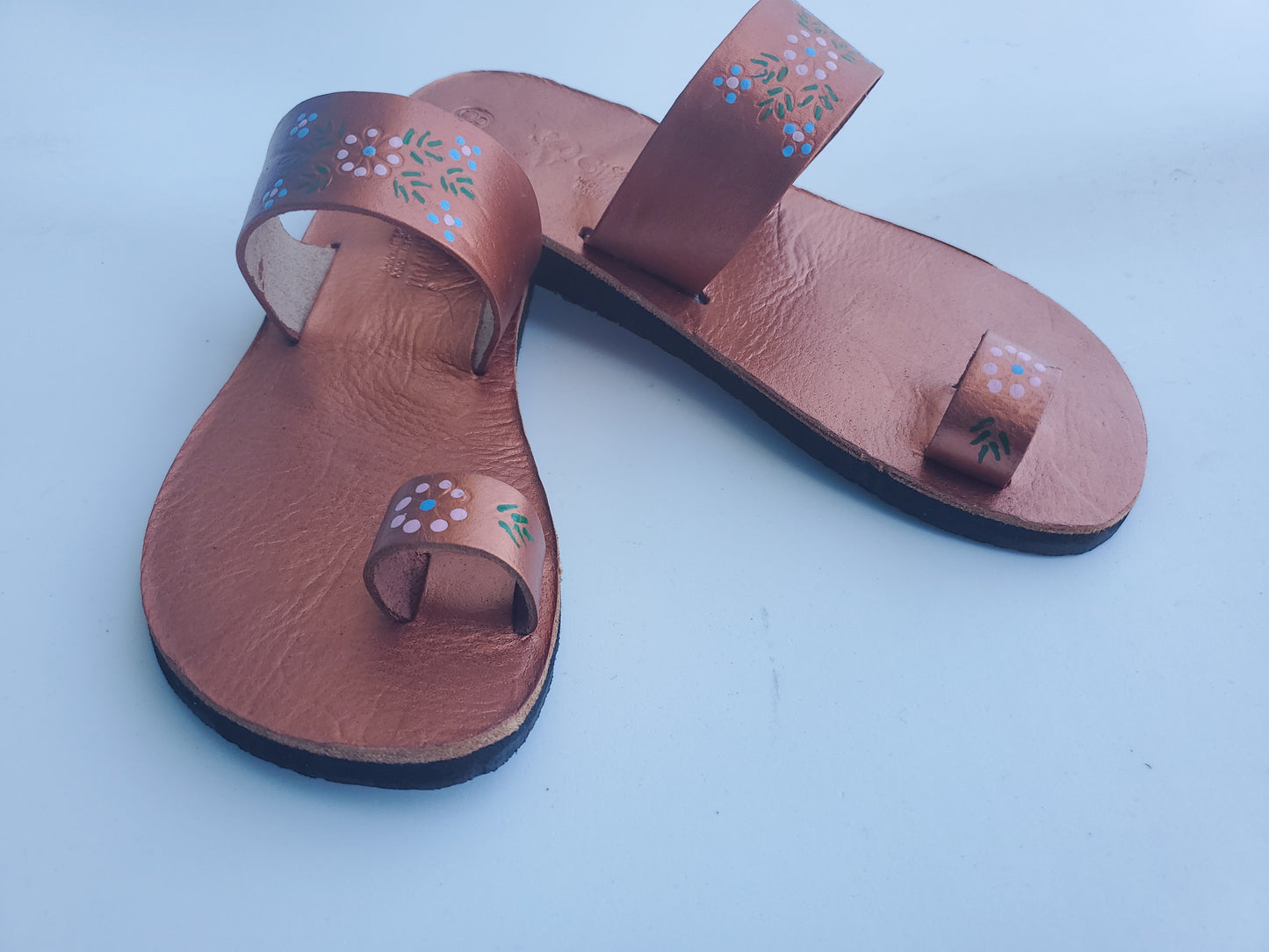 Copper color soft leather handmade toe-ring sandals with  durable lightweight outsoles and hand-painted floral pattern